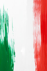 Italian flag made with green and red paint. Brush stroke effect. Vertical photo.