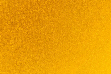 yellow frost on a glass background. texture patterned frosted glass.