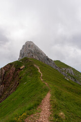 summer mountains green grass and blue sky landscape near achensee in austria, europe alps in cloudy day