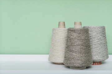 Fototapeta na wymiar Set of colored yarn for knitting on cone