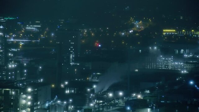 night timelapse with industry smoke and traffic