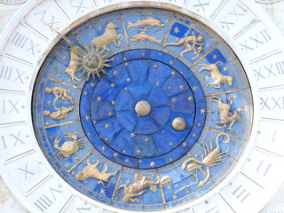 Beautiful sundial with a golden sun in Venice