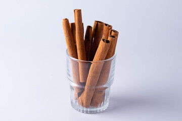 A pile of cinnamon on a white background
