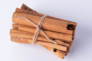 A pile of cinnamon on a white background