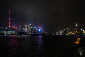A night view of the modern Pudong skyline across the Bund in Shanghai, China. Shanghai is the largest Chinese city.
