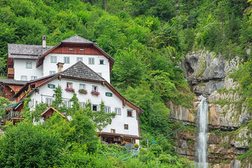 Idyllic waterfall in Hallstatt seen from the village centre