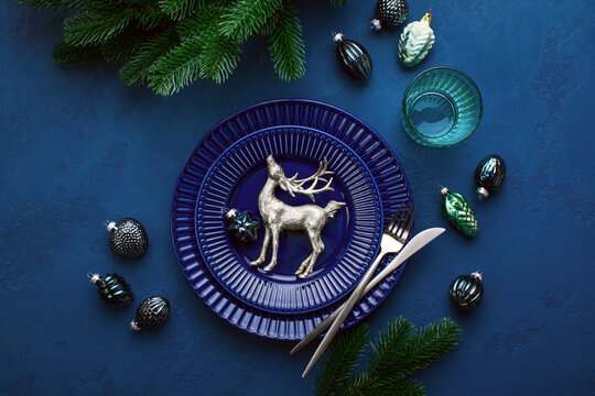 Christmas Festive Dinner Table Setting In Dark Blue Tones