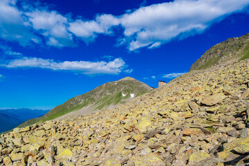 summer sunny day in a mountain valley with hut. Austria Alps.