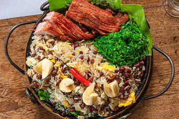 Pork loin with beans (Feijão Tropeiro), traditional dish of Brazilian and Minas Gerais cuisine.