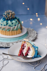 
Delicious and beautiful Christmas cake in the form of a knitted hat, sprinkled with powdered sugar. Vanilla biscuit with cranberry filling. New year cake