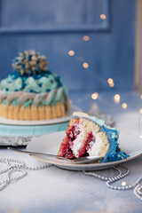 
Delicious and beautiful Christmas cake in the form of a knitted hat, sprinkled with powdered sugar. Vanilla biscuit with cranberry filling. New year cake