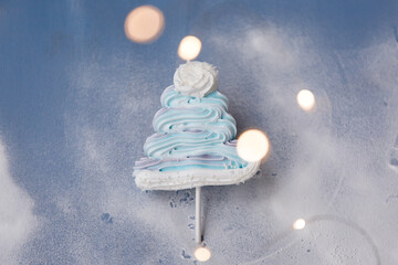 
New Year's candy meringue christmas tree with edible decorations, homemade christmas treat