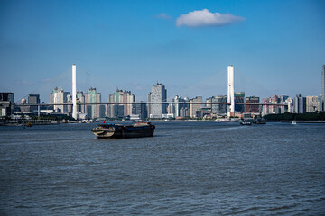 Naklejka premium Shanghai skyline, landmarks of Shanghai with Huangpu river at sunrise/sunset in China.
