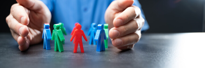 Hands Protecting Paper People