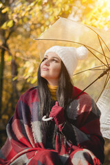 The girl is enjoying the autumn day