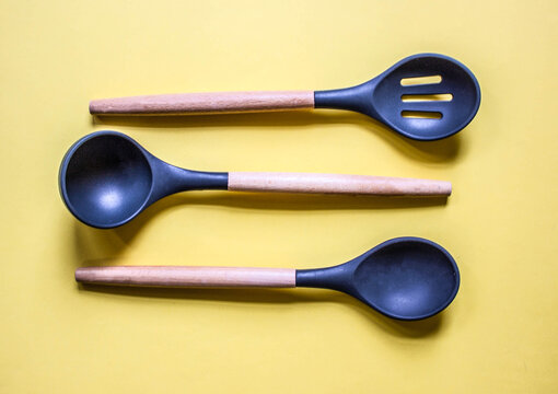 flat lay on yellow background kitchen cooking tools and accessories. Concept of home design. Free copy space.