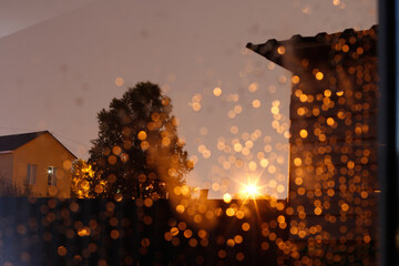 glare of the streetlight in the window