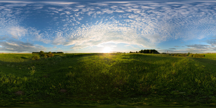 Sunset on meadow spherical 360 degree panorama