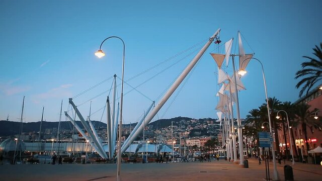 Bigo elevtator in Old City Port area of Genova,Italy.Populat travel destination for cultural tourism in Liguria,Italia.Beautiful Genovese marina filmed at sunset