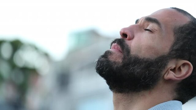 Faithful 40 year old man looking at sky with hope