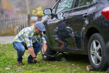 Man changing a flat tyre