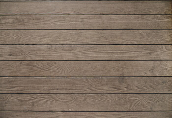 Fototapeta na wymiar Brown wooden table surface of horizontal planks with natural wood texture as background