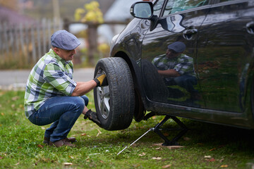 Man changing a flat tyre