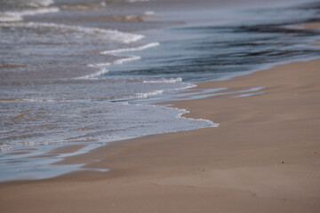 Fototapeta premium sea beach with white sand and blue water before storm