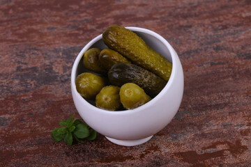Pickled cucumbers heap in the bowl