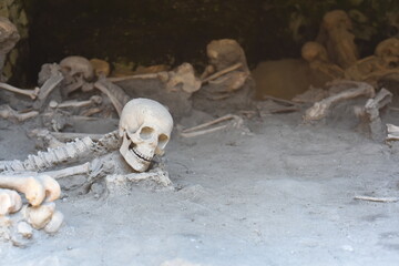 Skeletons in Herculaneum, near Naples, Italy. These people were killed by a pyroclasic flow during the eruption of Mount Vesuvius in 79 AD.