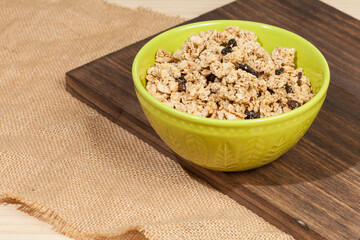 Healthy food; Crunchy granola sweetened with honey, has raisins.