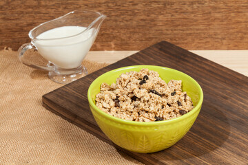 Healthy food; Crunchy granola sweetened with honey, has raisins.