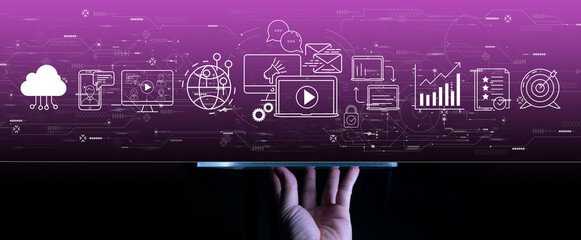 Digital marketing with person hand using a digital tablet computer on dark violet background.