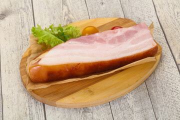 Smoked pork breast with salad leaves