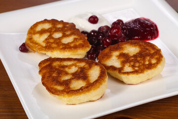 Pancakes with jam and berries