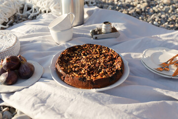 Beach picnic with cake and figs