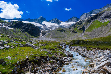 Fototapeta na wymiar Mountain river valley landscape in Hohe Tauern Austrian Alps, Europe