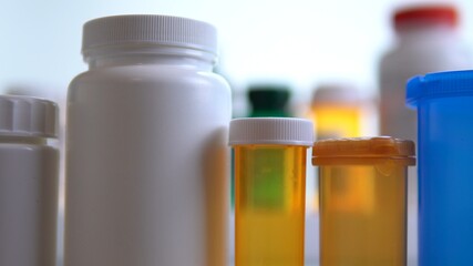 Different pills bottles macro close up shot. Pharmacy table. Modern drug and pharmacy industry concept. Research and development medicines to prevent or treat coronavirus COVID idea.