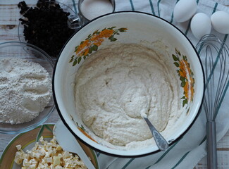The process of making semolina pie with ingredients on a wooden background.Food background.