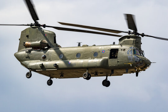 Royal Air Force CH-47 Chinook cargo helicopter in flight over RAF Fairford airbase.