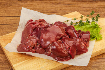 Raw chicken liver over board