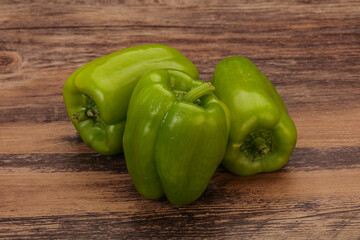 Three green bell juicy peppers