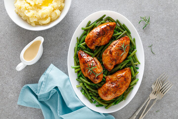 Roasted chicken breast with green beans, boiled mashed potatoes and gravy
