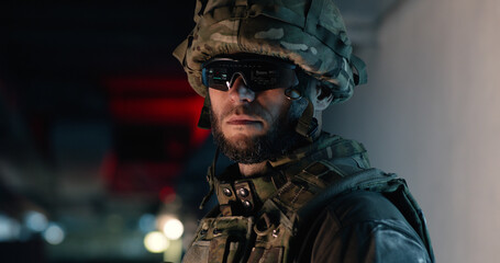 Soldier in hi tech goggles during military mission