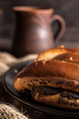 Autumn still life, fresh baked bun on wooden background