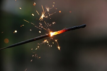 close up of a burning sparkler in the silvesters night