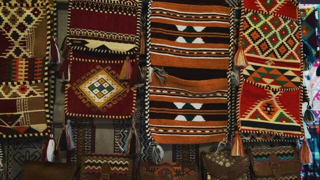 Traditional colorful Arabic Persian Textile and small handbags close up shot