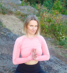 Beautiful girl yoga in nature in a pose