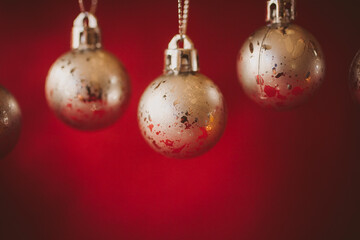 Golden christmas balls on red background. Christmas background.	