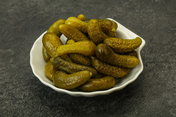 Pickled gherkin in the bowl
